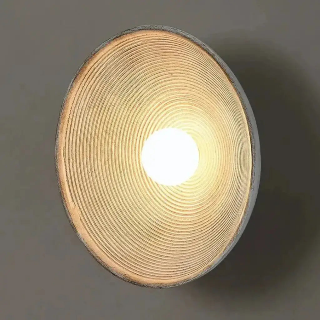 Wall Sconce Lamp with Concentric Ripple Resin Texture and Modern Ambient Lighting